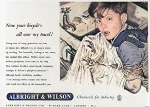 Dries: Boy drying his face on a towel