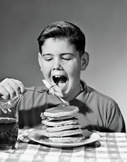 Pancakes: Boy Eating Stack of Pancakes