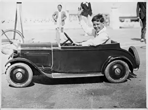 Millionaires: BOY IN ELECTRIC TOY CAR
