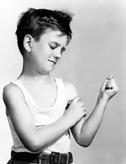 Flexing: BOY FLEXING HIS MUSCLES