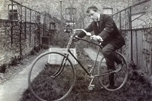 Outhouse: Boy getting on to his new Bicycle