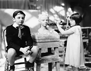 Employ: Boy and girl in an artist studio