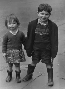 Wellies: Boy and girl standing on a pavement
