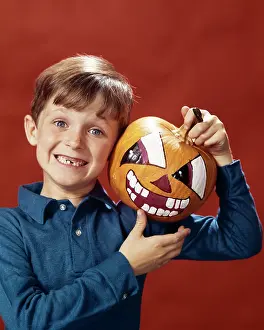 Jack O Lantern: Boy and Halloween Painted Pumpkin both missing teeth