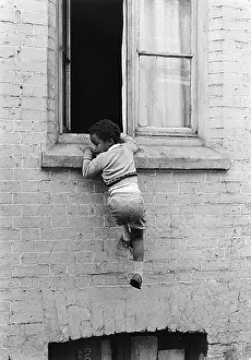 Sill: Boy hanging from a windowsill