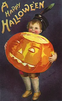 Haloween: Boy holding huge Jack-O-Lantern