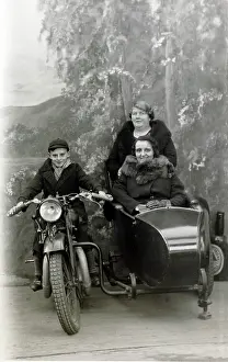 Michael Cole: Boy & ladies on a 1929 Coventry Eagle in a studio