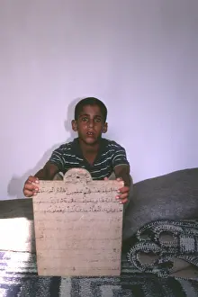 Pupil: Boy learning Koran at Sirte, Libya