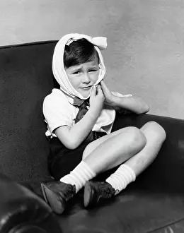 Gland: Boy Looking at Camera Head Wrapped in Pain From Sore De