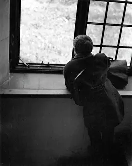 Satchel: Boy looking out of a window