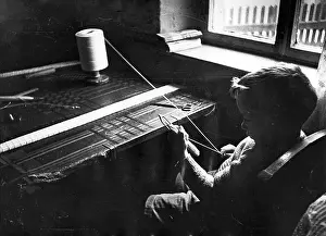 Reel: A boy making fishing nets, WW2
