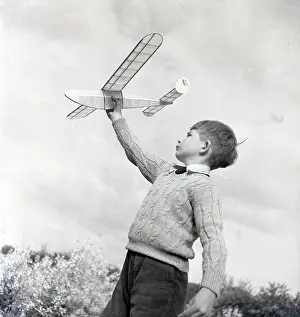 A Flying History - Peter Keating Aviation Collection: Boy with a model aeroplane