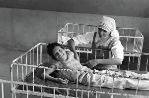 Poorly: Boy with nurse, Jaipur, India