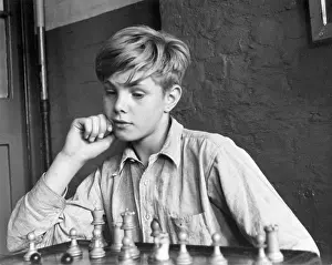 Intelligent: Boy playing chess