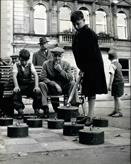 Hooked: Boy playing open air draughts in Crieff, Scotland