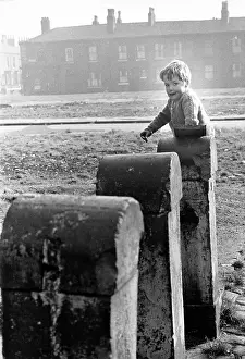 Wasteland: Boy playing on waste ground