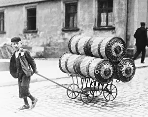 Franconian: A boy pulling a cart with baskets, 1905