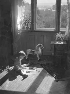 Nurseries: BOY READING IN NURSERY
