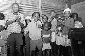 Dumped: Boy reciting poem; Children singing at Rooigrond school