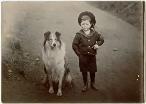 Walkies: Boy in a sailor suit with a collie dog