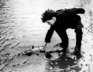 Swelling: Boy salvages toy in flood