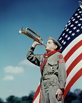 Bugles: Boy Scout Blowing Bugle in Front of 48 Star American Flag
