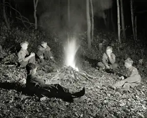 Thrifty: Boy Scout Troop Sitting Around Campfire at Night