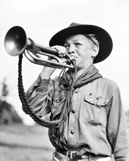 Thrifty: Boy Scout in Uniform Blowing