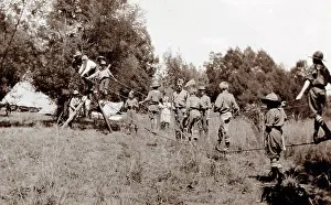 Constructing: Boy scouts constructing rope bridge, South Africa
