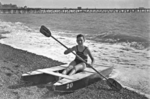 Pebbly: Boy at the seaside on a raft