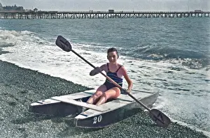 Pebbly: Boy at the seaside on a raft