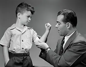 Bicep: Boy showing dad his muscles