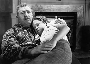 Grandparent: Boy sleeping on his grandfather's lap