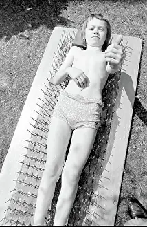 Stuntman: Boy stuntman on bed of nails