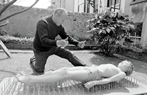 Stuntman: Boy stuntman on bed of nails