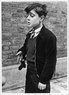 Swivels: Boy with a toy gun, Addison Place