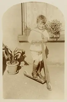 Aspidistra: BOY ON TOY SCOOTER