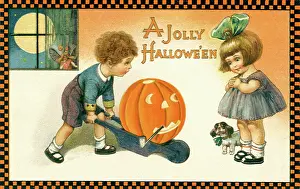 Wheeling: Boy wheeling Jack O Lantern in a cart to a dotinggirl