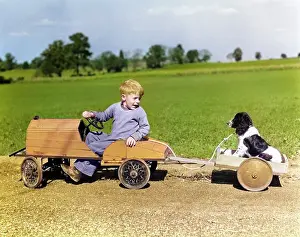 Hotrod: Boy in Wooden Toy Car Pulling Dog Behind