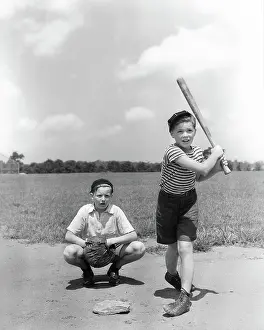 Pre Teen: Two Boys Batter and Catcher Playing Baseball