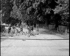Traps: Boys on Bicycles Testing Traps Set Up By British