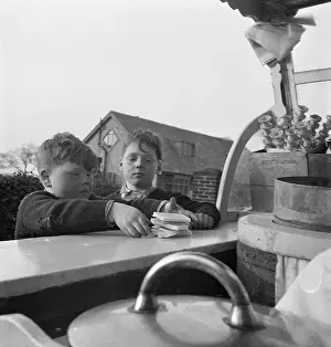 Chld: Boys buying ice-cream