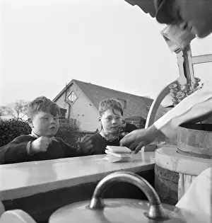 Chld: Boys buying ice-cream