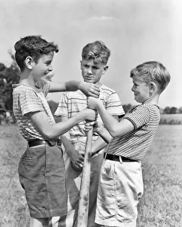 Sandlot: Boys Doing Hand Over Hand on Baseball Bat For