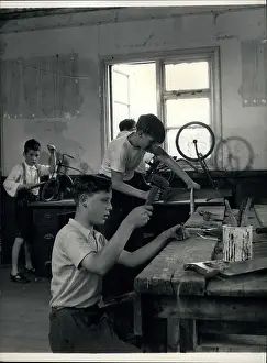 Unfit: Boys doing woodwork and repairing bicycles