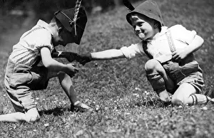 Lederhosen: Two boys finger wrestling, 1933