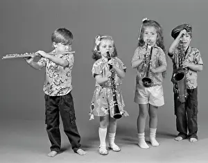 Saxophones: Two Boys And Two Girls Playing