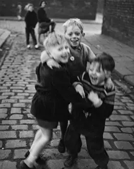 Blur: Three boys having fun in the street