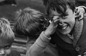 Joke: Three boys having fun in the street