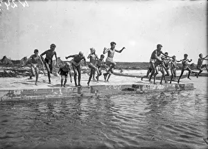 Werian: Boys jump into a pool of water